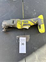 Ryobi oscillating multi-tool top view showing tool head and handle with battery slot area.