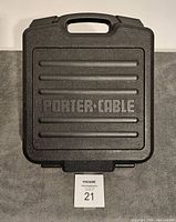 Closed black Porter Cable carrying case with handle and logo on surface.