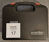 Closed black hard plastic carrying case with handle and red latches, branded ProActive Physiotherapy.