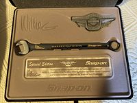 Black Snap-on wrench inside custom molded metal case with engraved plate showing Willie G. Davidson's signature, Snap-on branding, and warranty text.