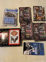 5 boxes of Harley-Davidson valentines and a 10-piece light set box showing logos and packaging details.