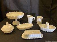 Full set of Westmoreland Paneled Grape milk glass items including compote, butter dish, creamer, sugar bowl, lidded round dish, basket and trays