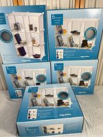 Five boxed 6-cube storage units stacked and arranged for sale.