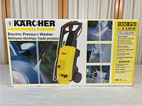 Box showing front of Karcher electric pressure washer with model number K3.99M and 1650 PSI rating