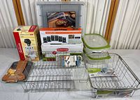 Full view of all items included in the lot, showing spice rack, produce saver containers, knife block, glass storage containers and wire racks arranged on a white surface.