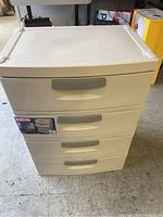 Front view of new Sterilite 4 drawer plastic storage unit showing four drawers and gray handles.