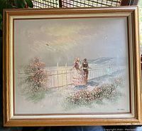 Frontal view of the framed oil painting showing a Victorian couple by the sea fence with a floral foreground and distant sailboats.