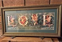 Full frontal view of the gold framed LOVE print featuring angels and florals forming each letter.