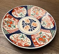 Top view showcasing the full pattern and colors of the charger plate on wood surface