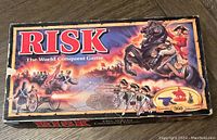 Top view of the vintage RISK board game box from 1993 showing artwork with soldiers and cavalry and storage wear on edges.