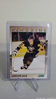 Front side of Jaromir Jagr rookie hockey card featuring Jagr in Pittsburgh Penguins uniform skating on ice.