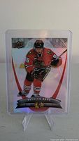 Front of Patrick Kane rookie hockey card with holographic design and player image