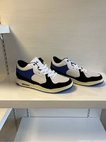 Side profile of the men's sneakers showing color details and design.