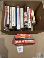 Box of assorted cookbooks and language books as viewed from above