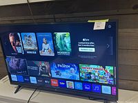 Front view powered on showing home screen and streaming apps