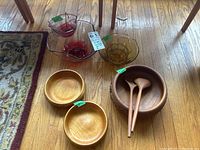 Full lot showing three glass chip and dip bowl sets and three wooden bowls including salad bowl with servers.