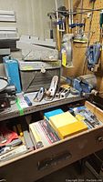 Workbench area showing wooden B/3 vise, metal hand planes, and some files and chisels on shelf