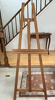 Front view of vintage Grumbacher wooden easel showing A-frame design with front adjustable support.