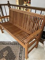 Side angle view showing armrest curve and leg design