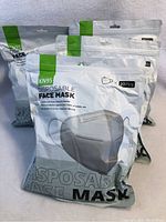 Four sealed packages of KN95 disposable face masks, each package labeled for 20 pieces.