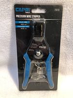 Front view of the Capri Tools Precision Wire Stripper in original sealed blister packaging showing branding, wire size range (solid wire 8-20 AWG, stranded wire 10-22 AWG) and product information.