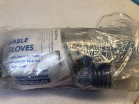 Pack of disposable chemical-resistant gloves wrapped in plastic