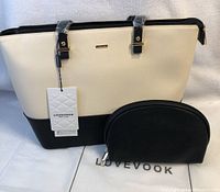 Photo of the new Lovevook purse handbag and smaller clutch pouch together, showing tags attached