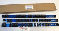 Three blue aluminum socket holders with multiple black clips placed next to original cardboard box and Olsatools tag.
