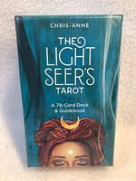 Front of sealed Light Seer's Tarot box showing title and mystical woman artwork with crescent moon on forehead.
