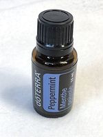 Sealed 15ml doTERRA Peppermint Essential Oil bottle showing label and cap.