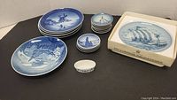 Five larger blue and white Royal Copenhagen plates, 10 smaller blue and white Danish plates arranged with one boxed Bing & Grondahl plate