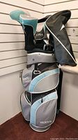 Full view of gray and teal Mizuno Sora stand bag with clubs inserted