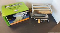 Pasta machine and box showing overall product and packaging