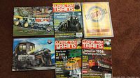 Five model train magazines displayed