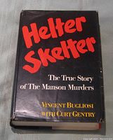 Front cover of the book showing title 'Helter Skelter' and authors' names on black background with minor wear on dust jacket edges.