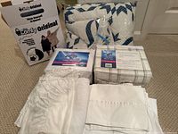 Queen and full size bedding items including sheets, quilt, dust ruffle and Sherpa blanket box