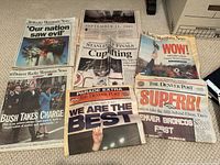 Photo showing 7 historic newspaper front pages including 9/11 attacks, Stanley Cup Finals, Super Bowl, Bush presidency.