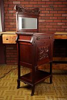 Right-front angled view showing full stand, mirror, drawer and lower shelf