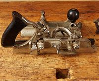 Angle view of Stanley No.45 combination plane with fence and depth stop