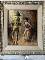 Frontal view of oil painting in ornate gilt frame with linen liner