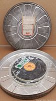 Closed metal film reel case with front label showing production, distribution, and filming details from the National Ballet School dated 29-5-79.