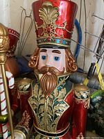 Front view of nutcracker showing head, hat and upper torso