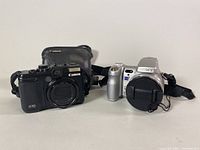 Front view showing both Canon PowerShot G10 and Sony DSC-H9 side by side