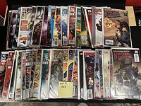 Photo showing the full collection of 50 comic books in two rows, all bagged and boarded.