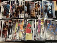 Collection of approximately 50 high grade comic books bagged and boarded, featuring multiple Marvel and DC characters and titles.