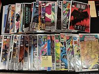 Photo showing entire collection of 50 comics in protective bags and boards.