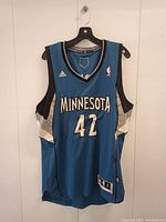 Front view of Kevin Love Minnesota Timberwolves basketball jersey, blue with number 42 and NBA logo