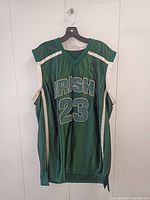 Front view of LeBron James highschool basketball jersey, green with white trim, showing 'IRISH' and number 23