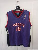 Front of purple Vince Carter Toronto Raptors basketball jersey with number 15 and Champion logo
