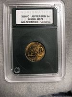 Front image of coin in protective slab showing certification label and full coin details.